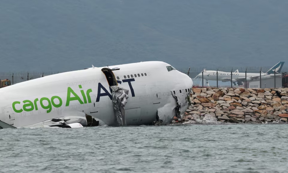 Cargo plane slides off runway in Hong Kong, killing two airport staff