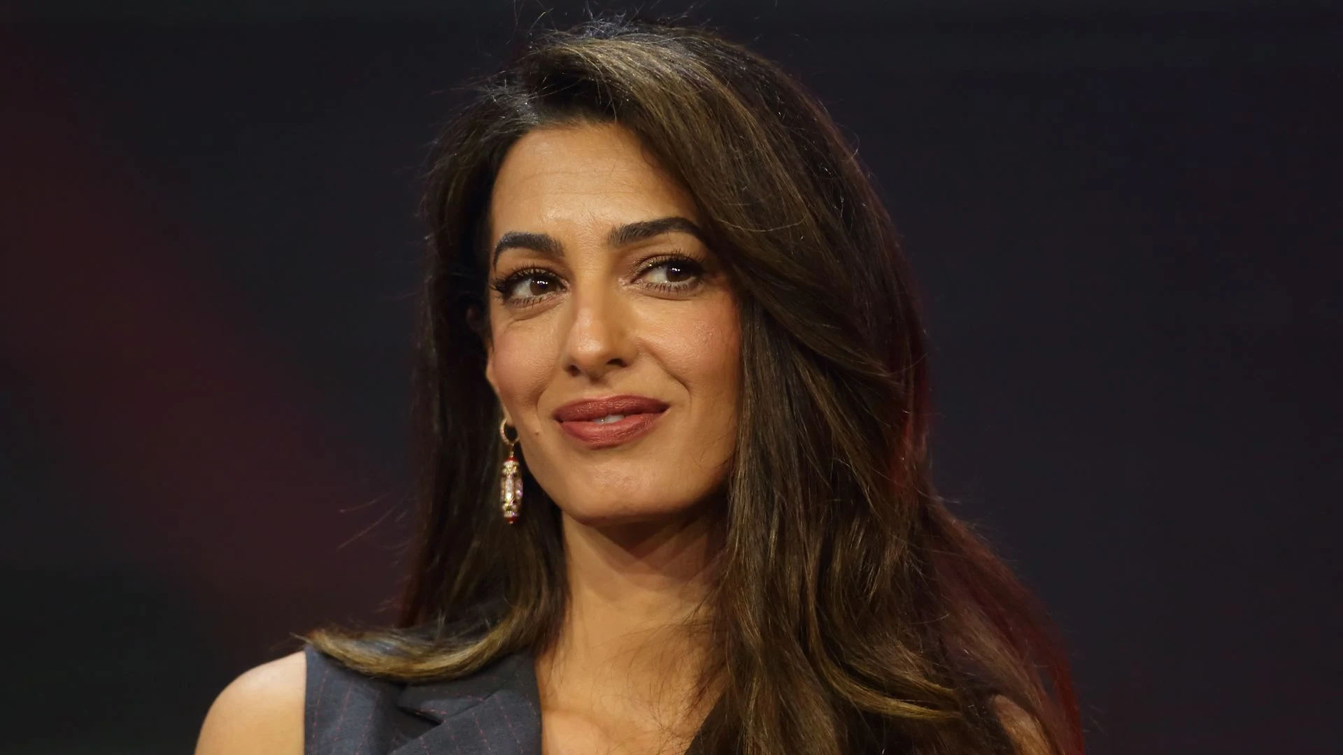 Amal Clooney's black thigh-high boots are an autumn/winter saviour