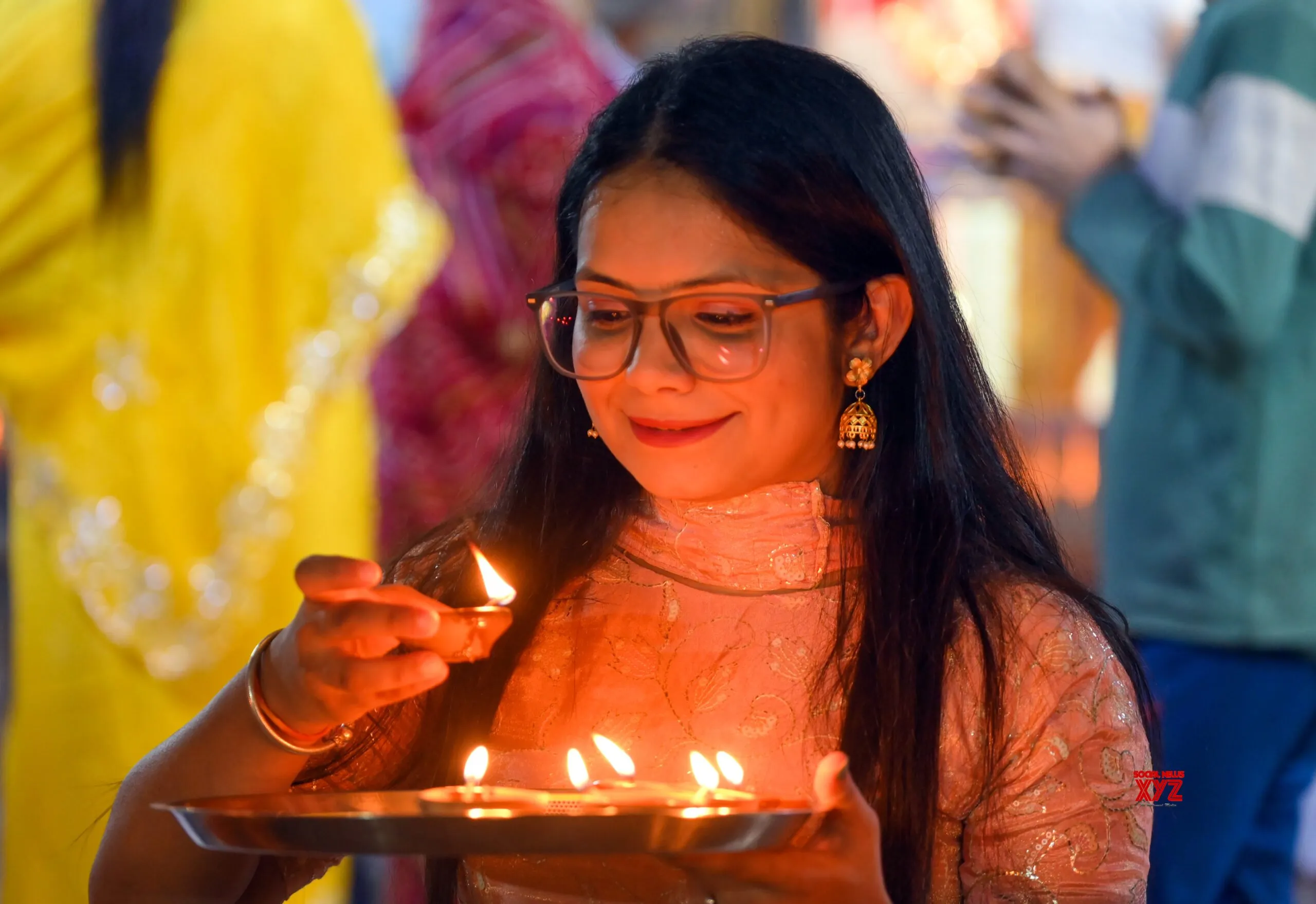 Women light earthen lamps on Diwali in Jaipur #Gallery