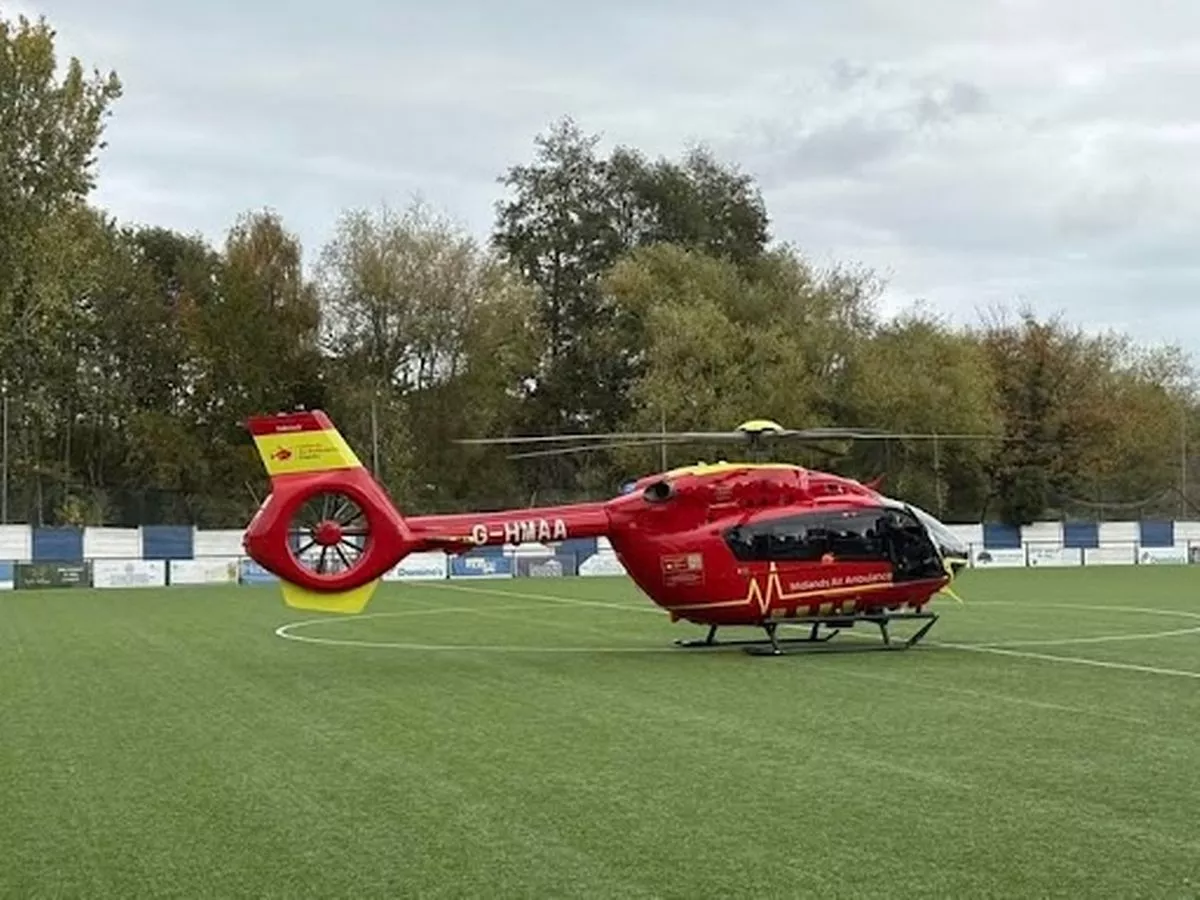 Air ambulance lands on football pitch after man falls from 'ladder'