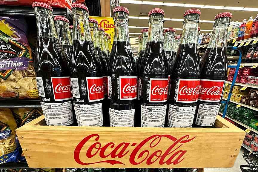 Coke reports revenue boost in 3Q