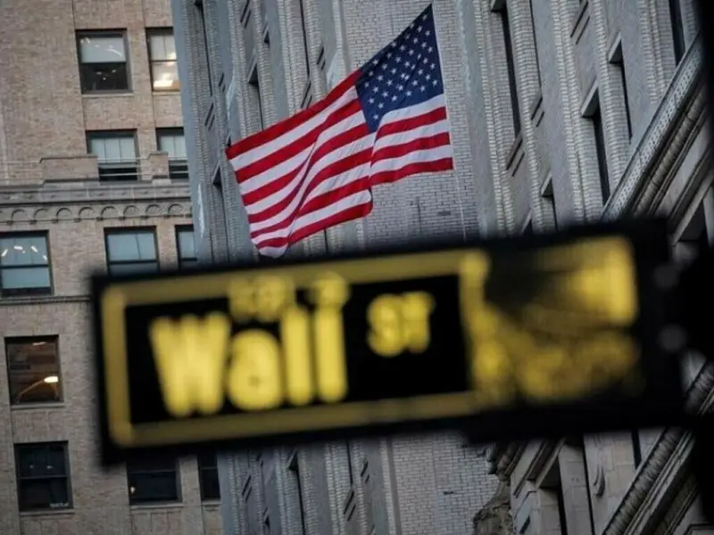 Wall Street ticks lower as investors digest earnings; Netflix drops