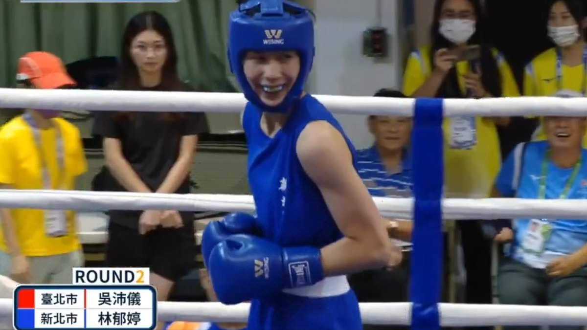 Astonishing moment gender-row boxer - who used sex tests loophole - smirks as female opponent throws in the towel and walks away mid-fight