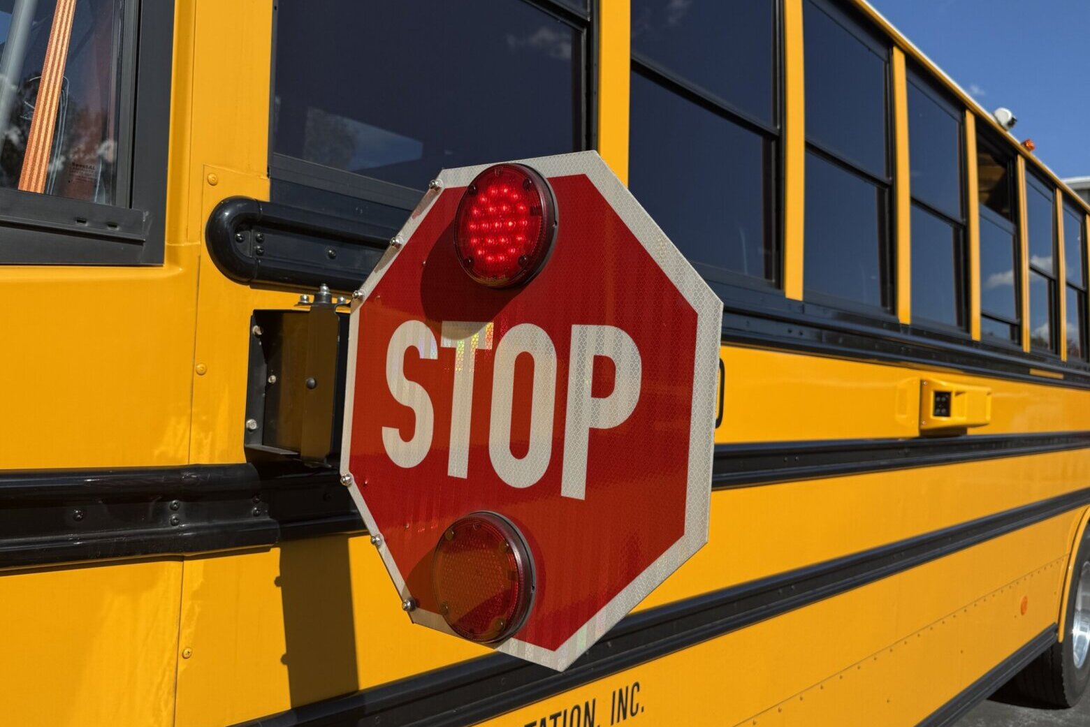 How effective are cameras used to catch drivers passing stopped school buses in Howard County?