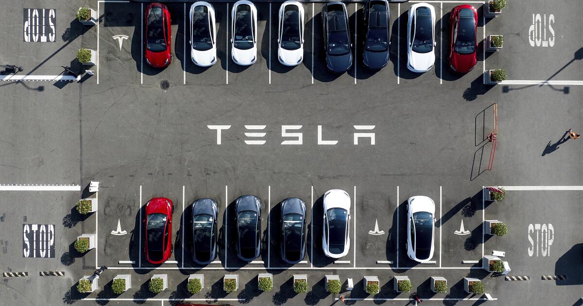 Tesla’s profit tumbles after costs undermine record EV sales