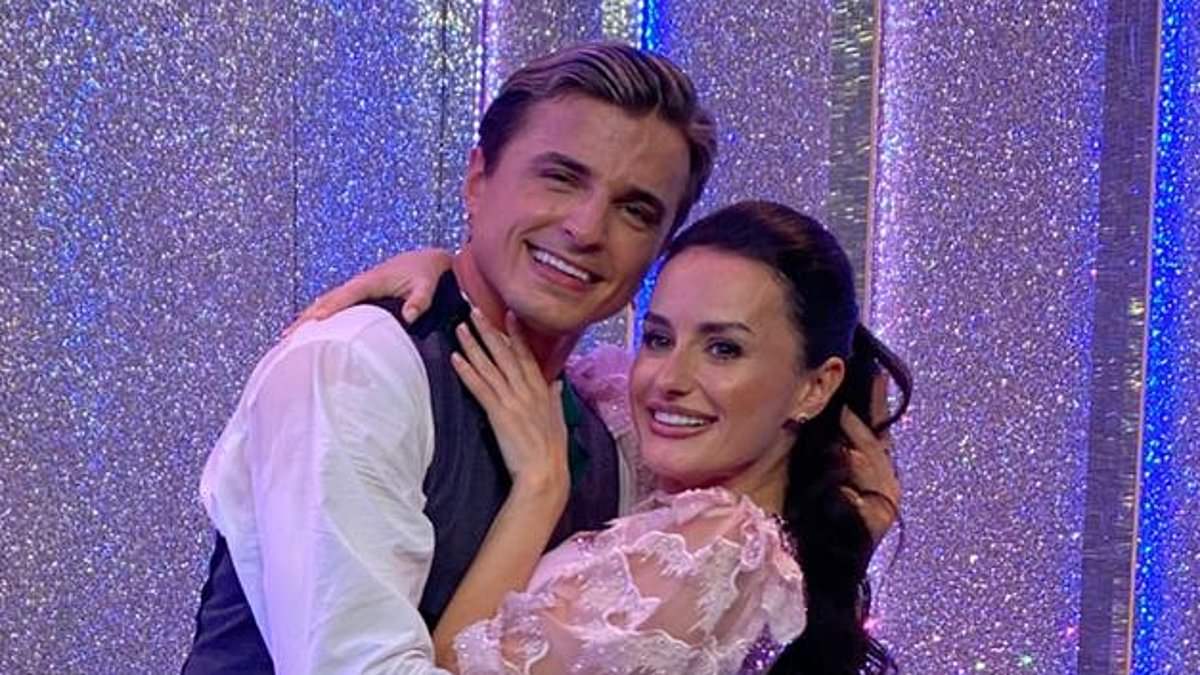Strictly's Nikita Kuzmin spotted kissing celebrity partner Amber Davies on the head as insiders say the pair's 'sizzling chemistry' has 'raised eyebrows from colleagues'