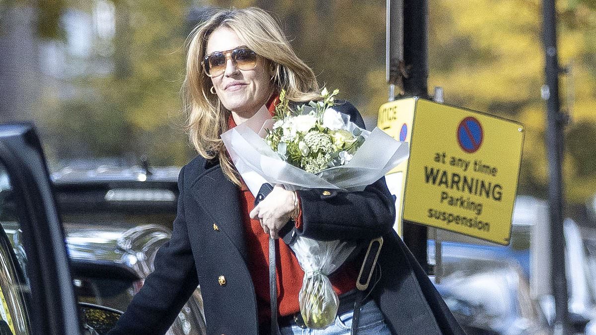 Cat Deeley looks effortlessly chic as she carries a huge bouquet of flowers after enjoying a shopping spree in Liberty London - following her split from husband Patrick Kielty