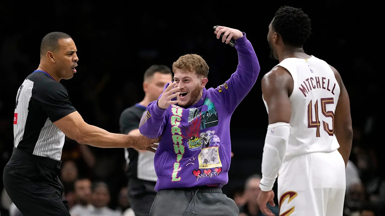 Fan storms court during NBA game seeking selfie with Cavaliers star Donovan Mitchell