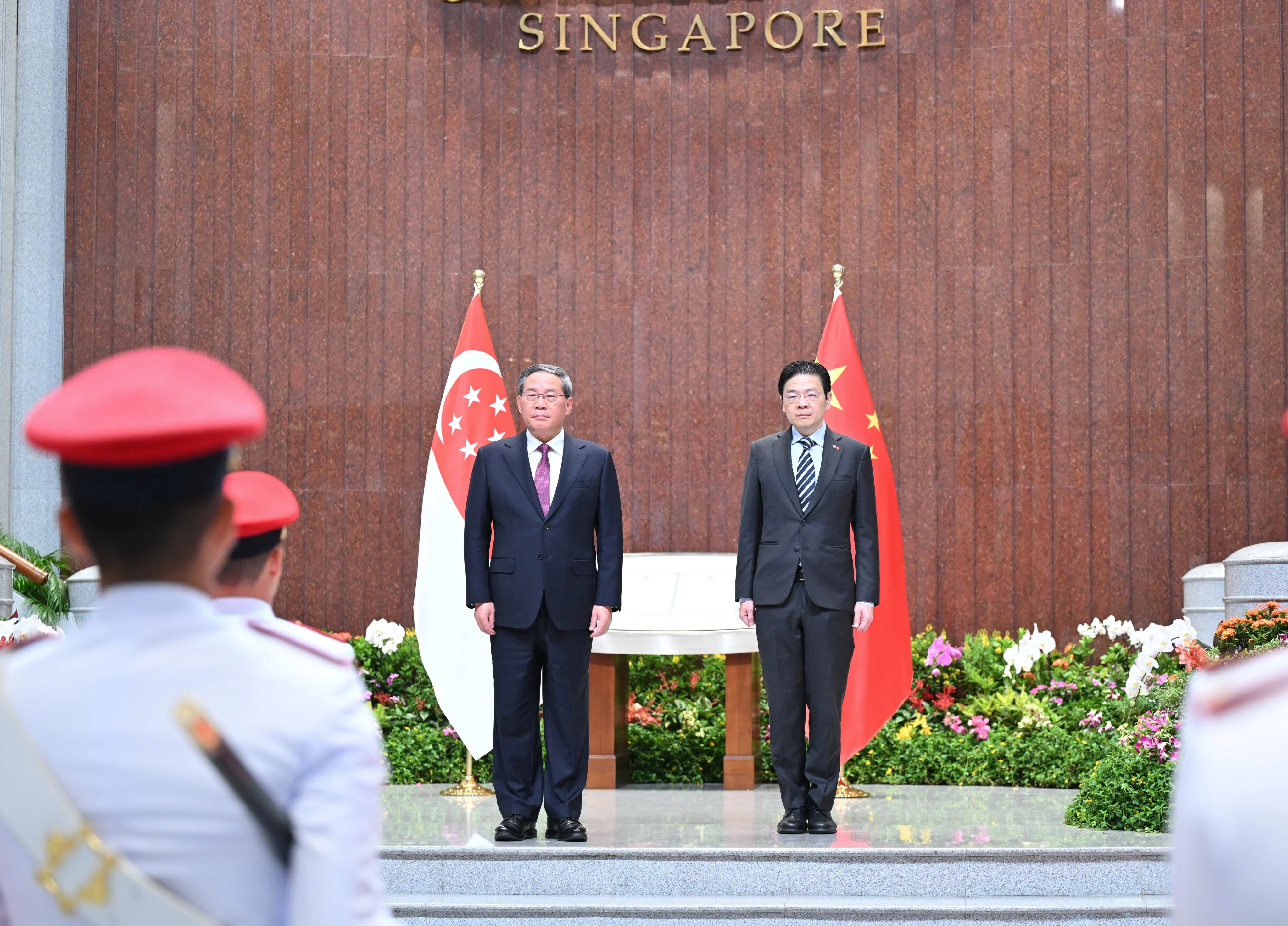 Singapore, China pledge to fight for free trade as Li Qiang visits city state