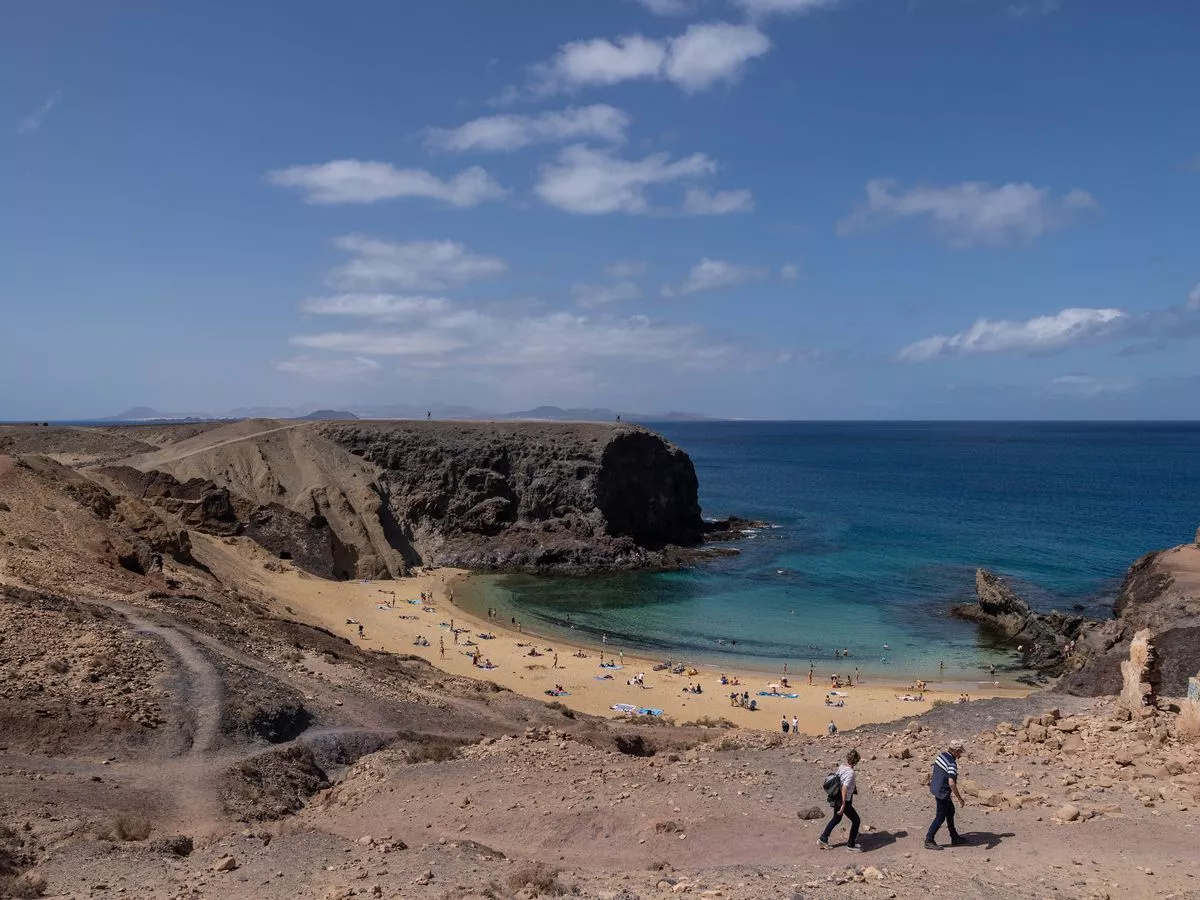 Brit, 56, dies and another critical after falling 20ft when 'hotel railing gives way'