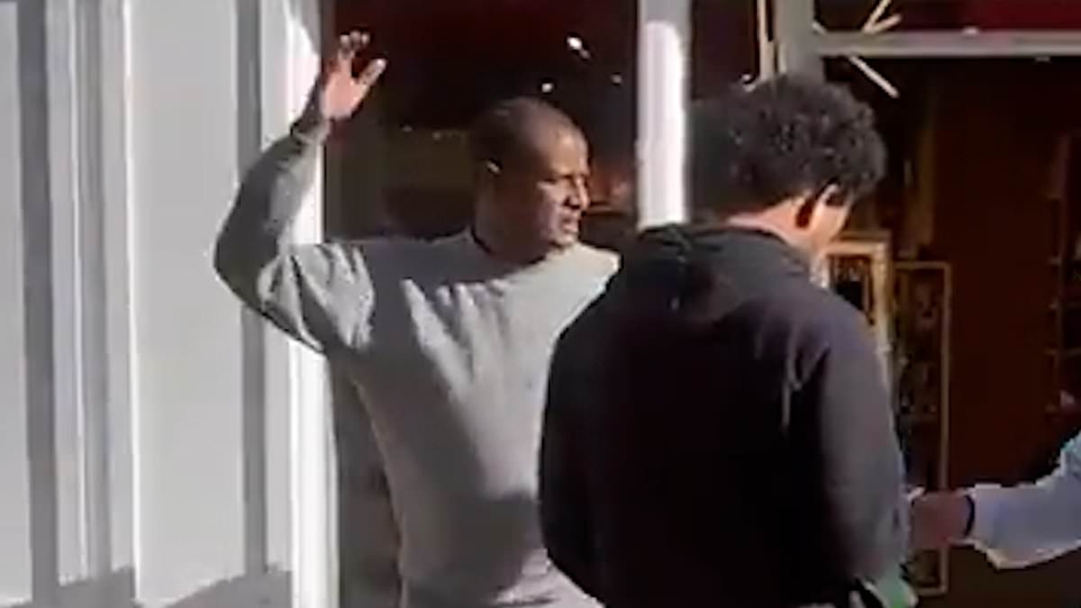 Prison staff guided 'confused' sex attack migrant to train station after he stood outside jail for 90 minutes - as manhunt to catch him hots up