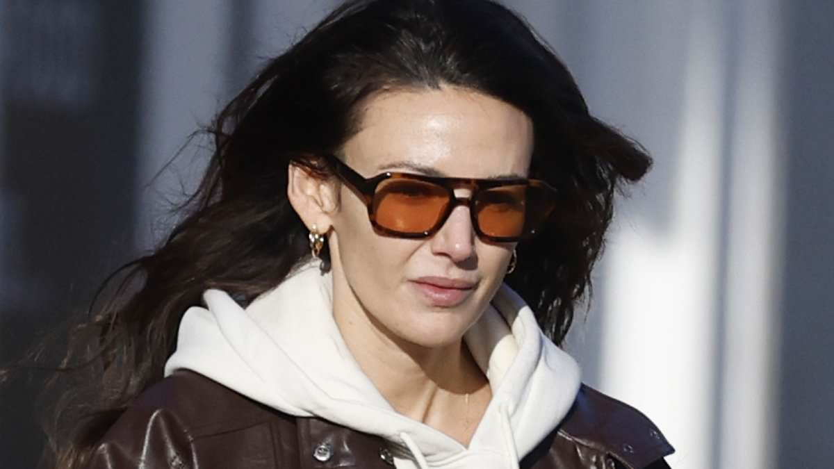 Michelle Keegan cuts a casual figure in a brown leather jacket and leggings as she hits the shops in Essex with baby daughter Palma