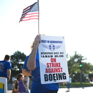 Striking Boeing workers rejected another offer as earnings loom