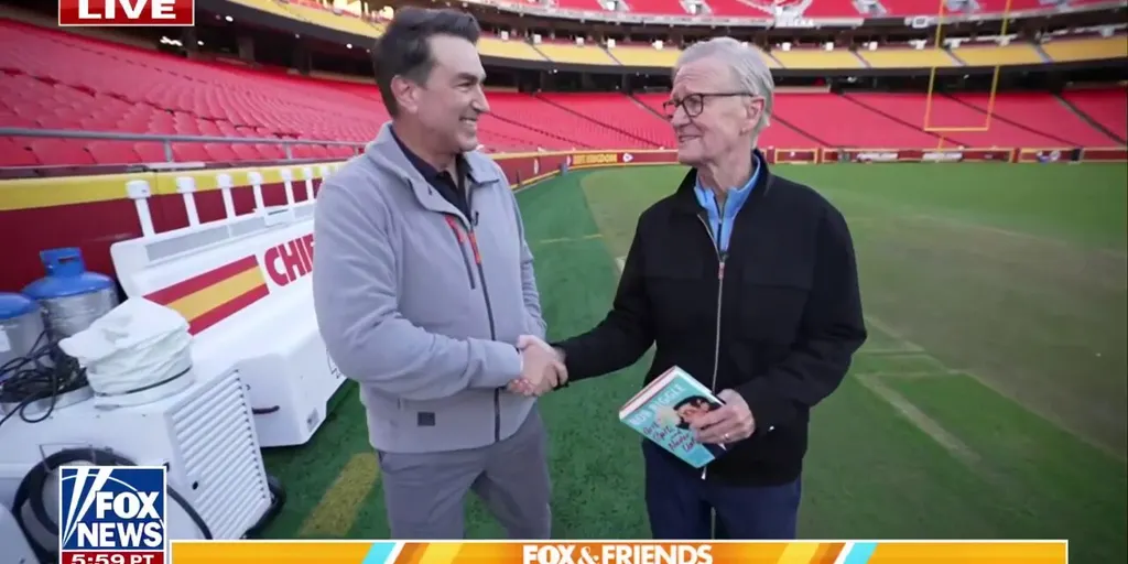 Steve Doocy hits the field with Rob Riggle at Arrowhead Stadium