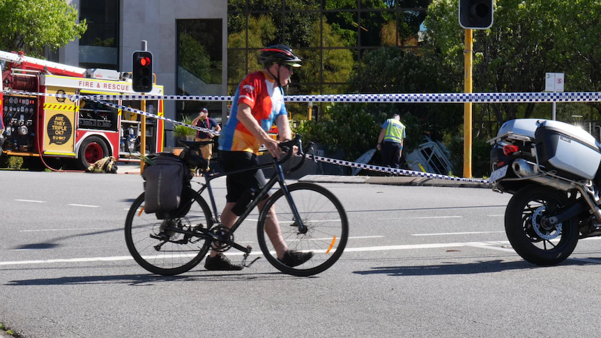 Cars smash into Perth office building, woman critically injured