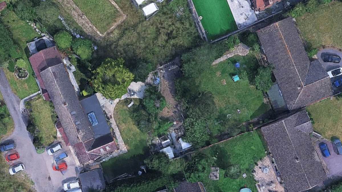 Construction boss and his wife in £250,000 court battle with village neighbours over claims they 'invaded' their garden to chop down 33-foot tall row of Leylandii trees