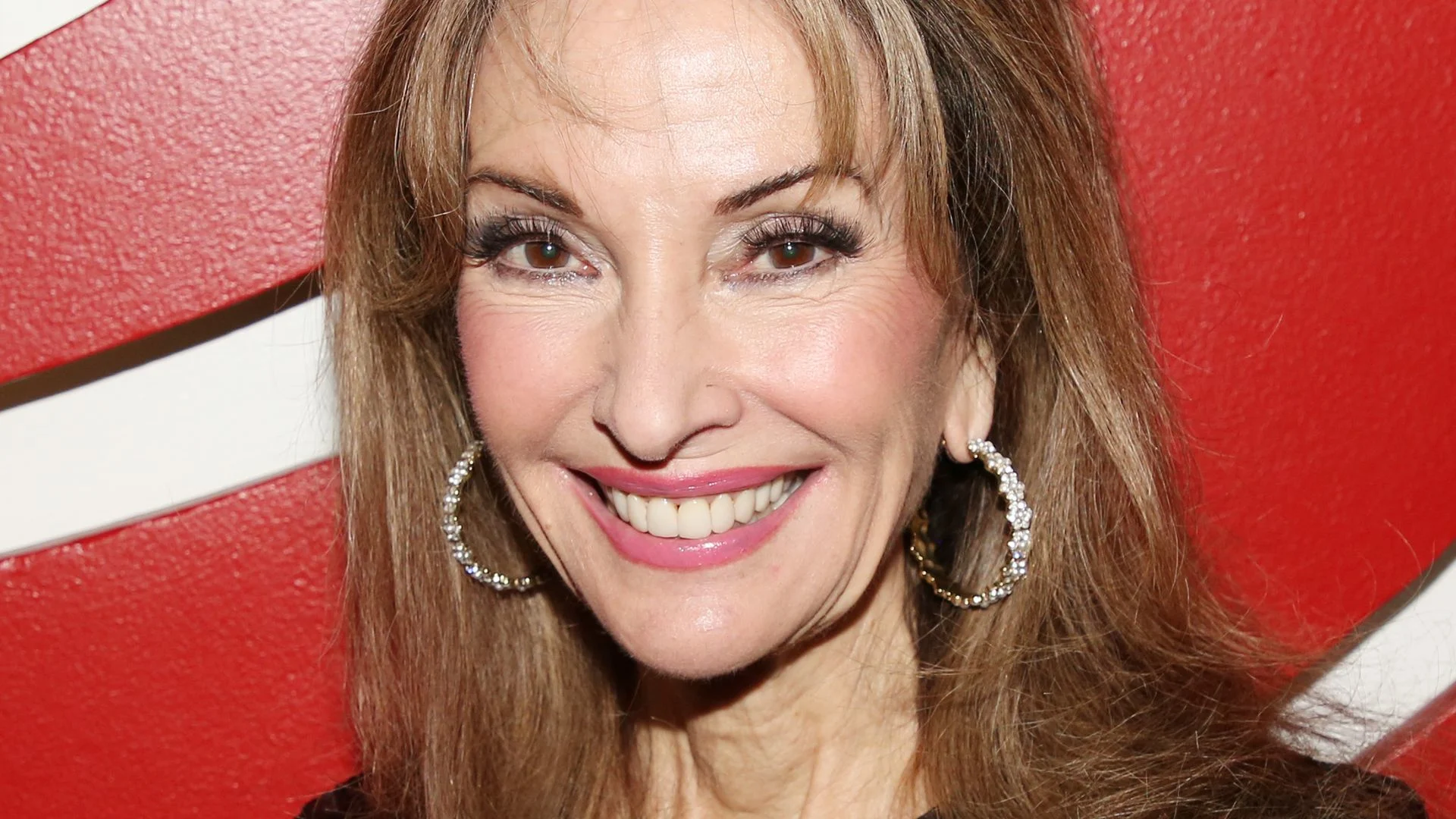 Susan Lucci stuns in tiny red lace dress as she pays tribute to 'the man who saved my life'