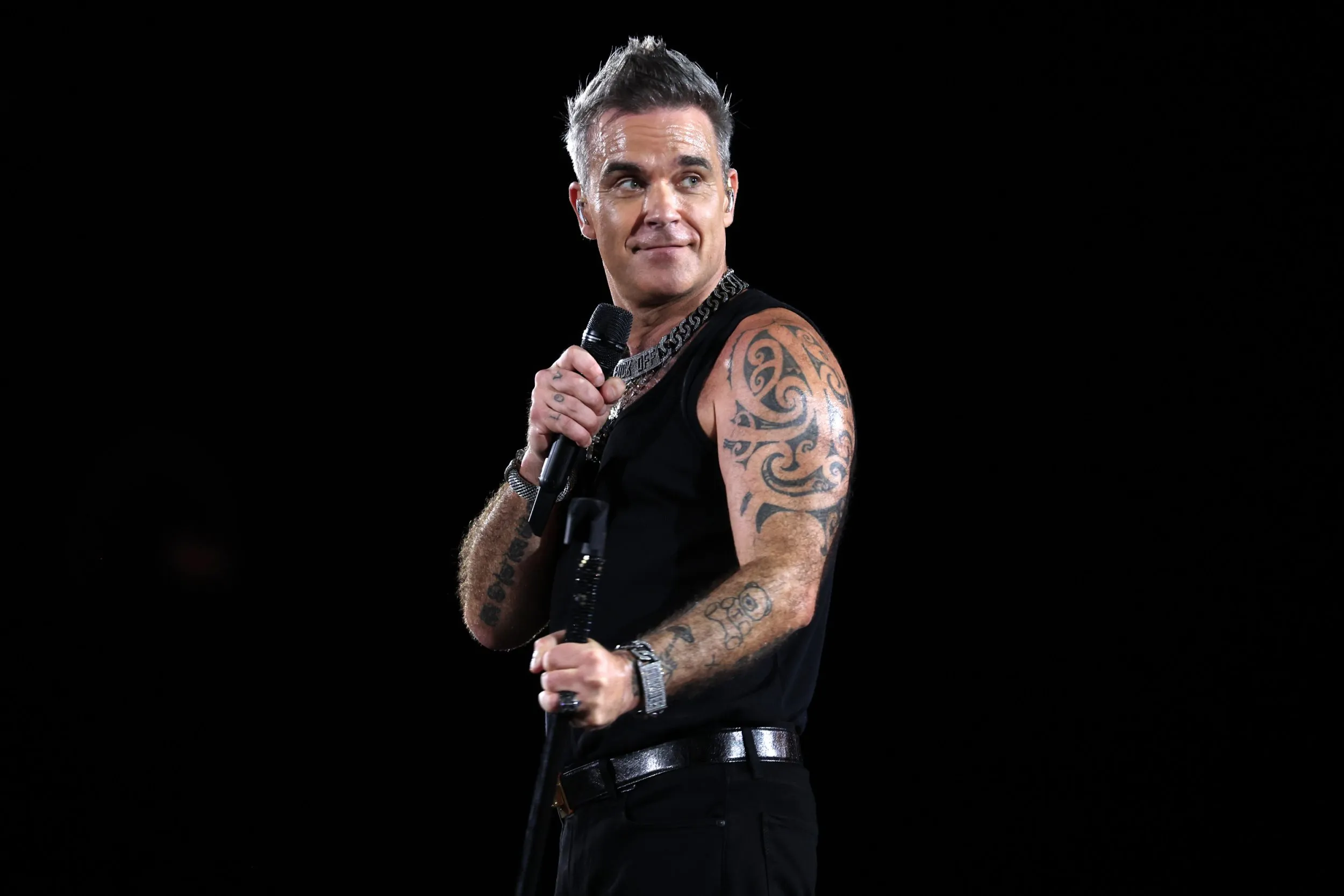 Robbie Williams teases surprise career change after album delay