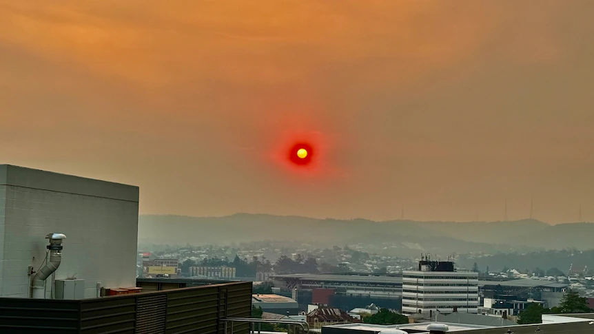 Tens of thousands without power as south-east Queensland chokes through smoke