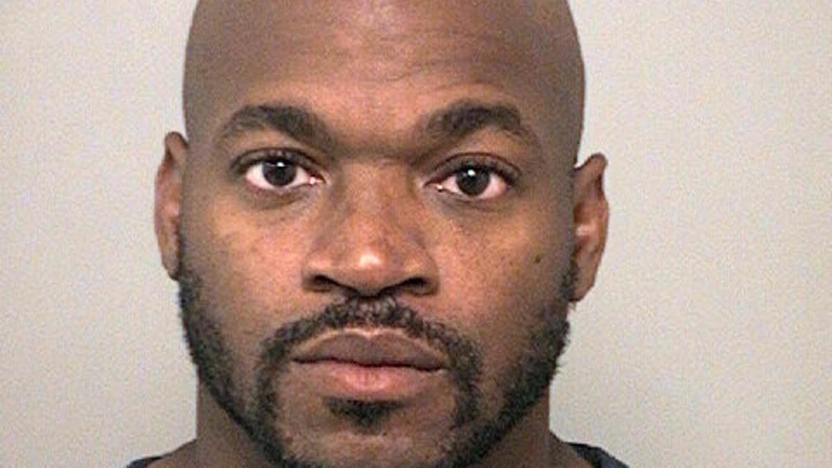 Ex-NFL star Adrian Peterson stares down the lens in new mugshot from his latest DWI arrest