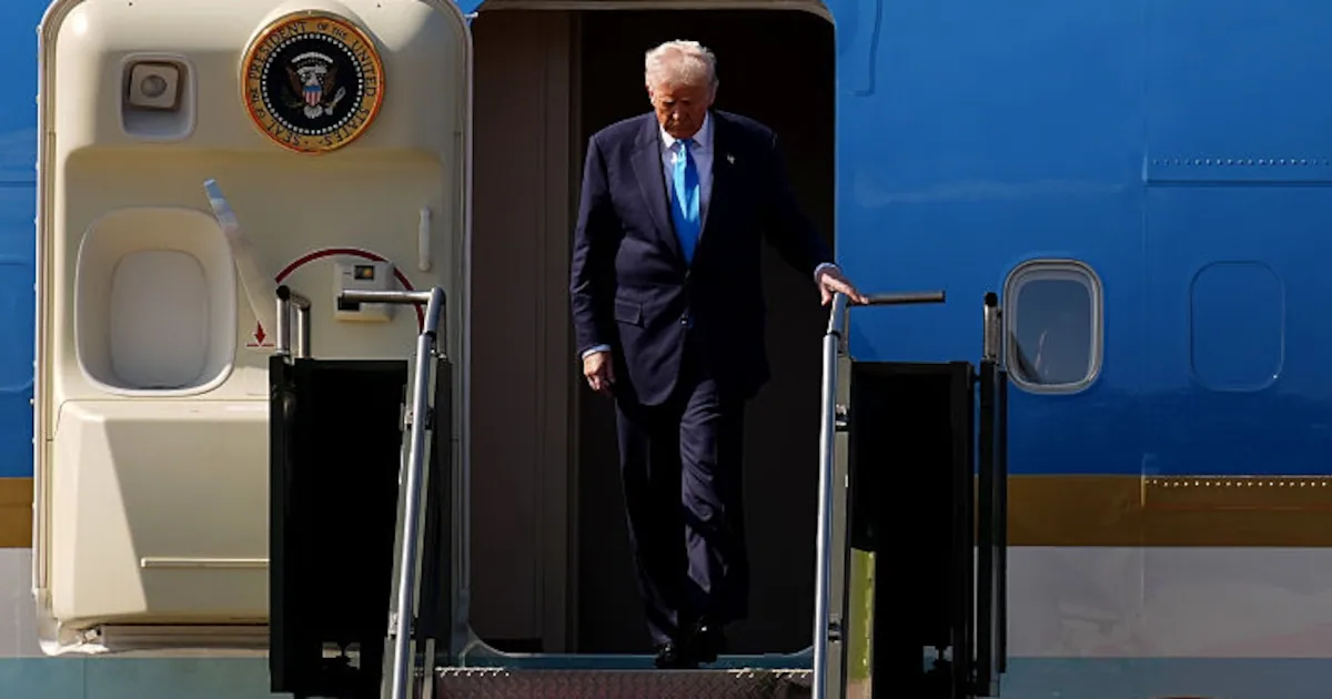 Trump, 79, Grips Railing for Dear Life While Descending Air Force One Stairs