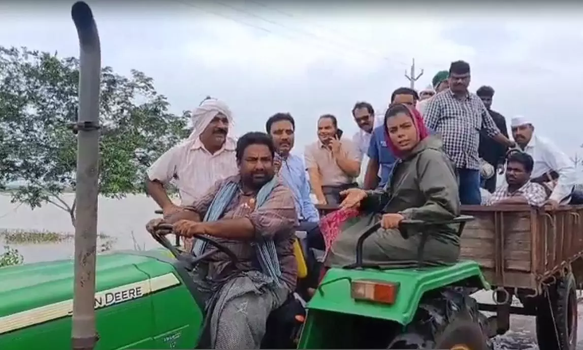 Guntur Collector Crosses Overflowing Stream on Tractor to Reach Flood-Hit Villages