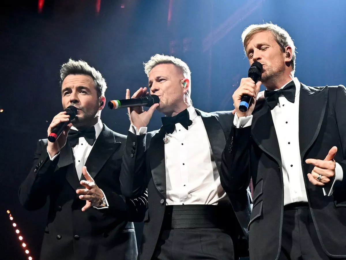 Westlife halt show for emotional Mark Feehily tribute at 25th anniversary concert