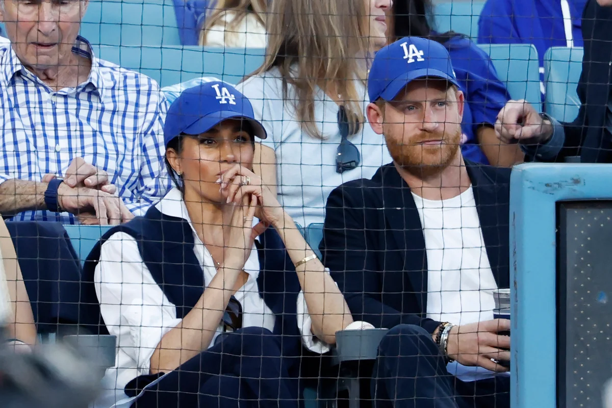 Prince Harry and Meghan Markle sit in front of LA royalty at Game 4 of World Series