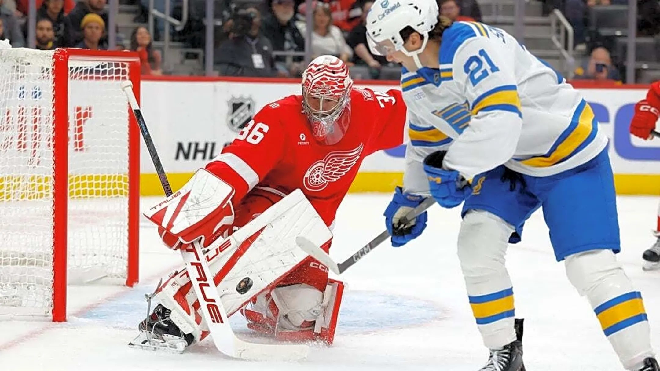 Red Wings erase four-goal deficit, top Blues at home