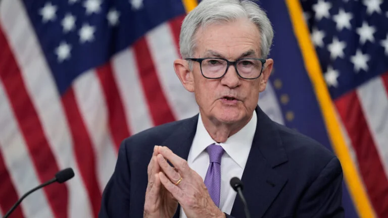 Powell, Federal Reserve cut key interest rate