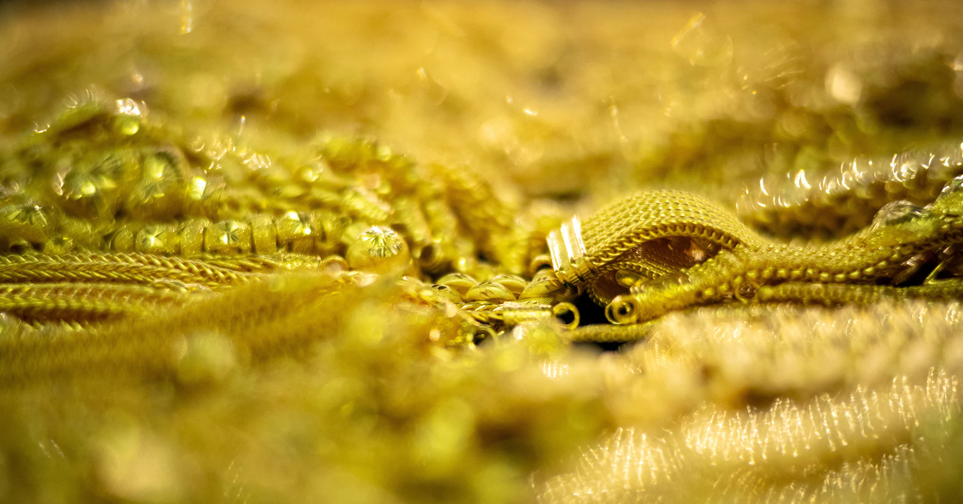 Gold ticks up on dollar retreat; Trump-Xi meeting in focus