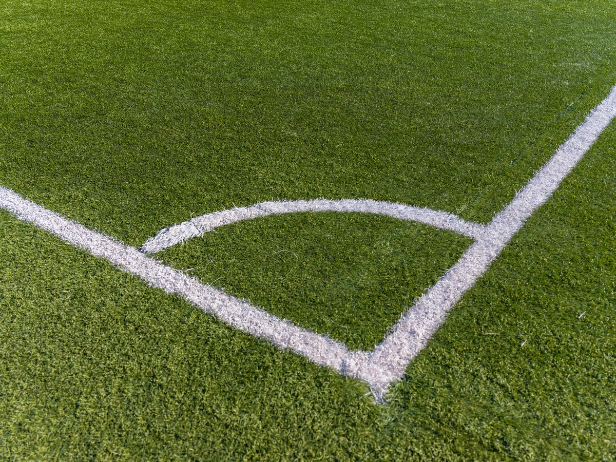 Footballer has fractured skull after men storm pitch in violent mid-match attack