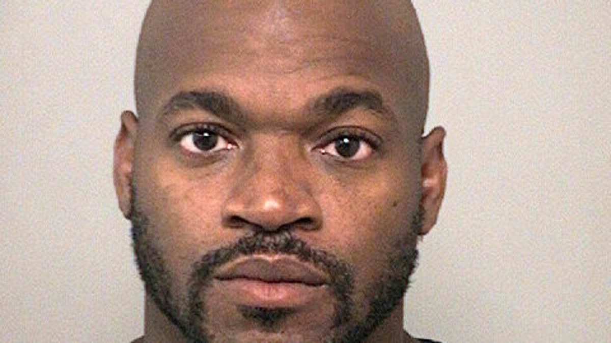 Ex-NFL star Adrian Peterson pictured 'asleep at the wheel' as he 'admits to drinking at poker game' before DWI arrest