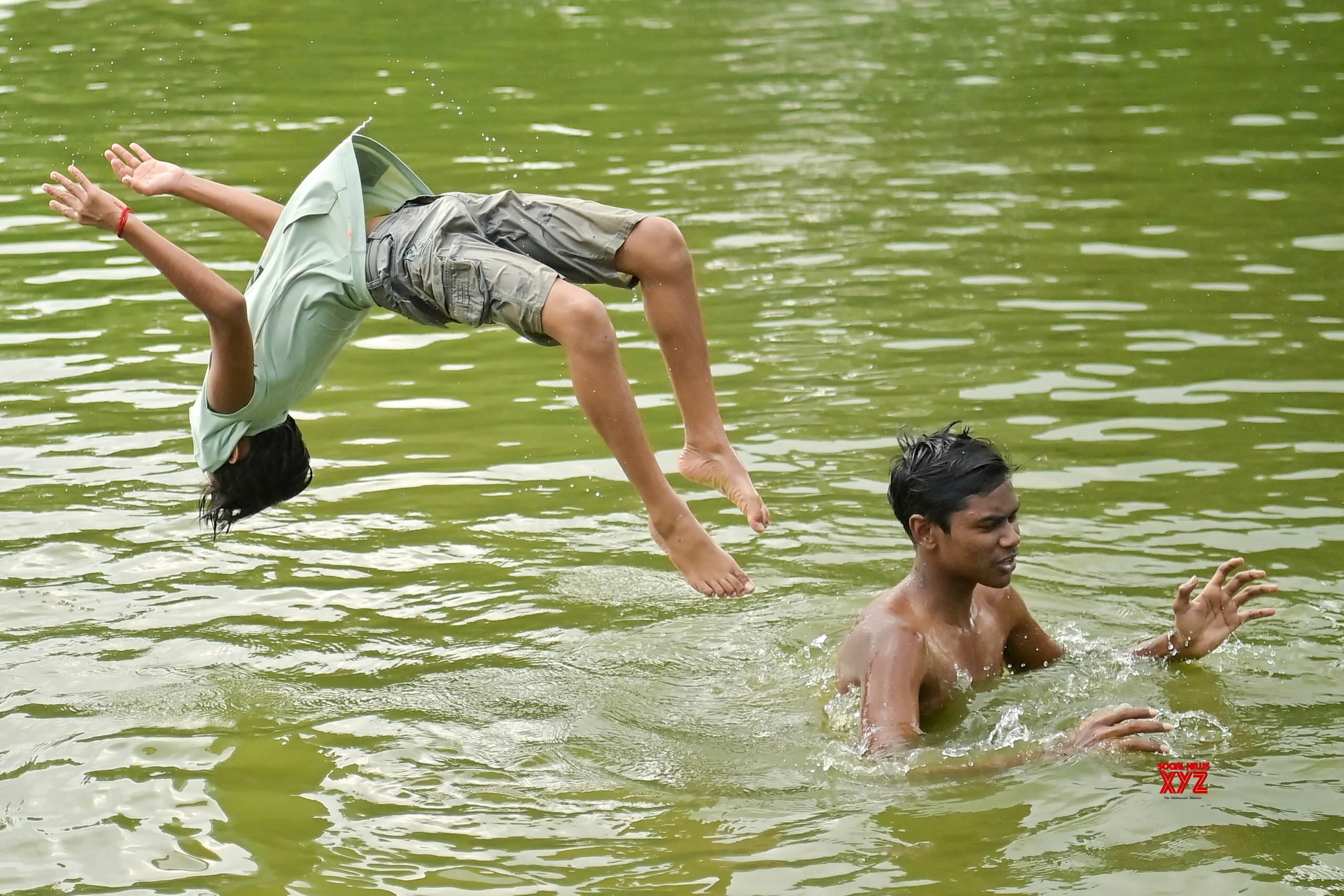 Boys Cool Off in Agartala Pond #Gallery