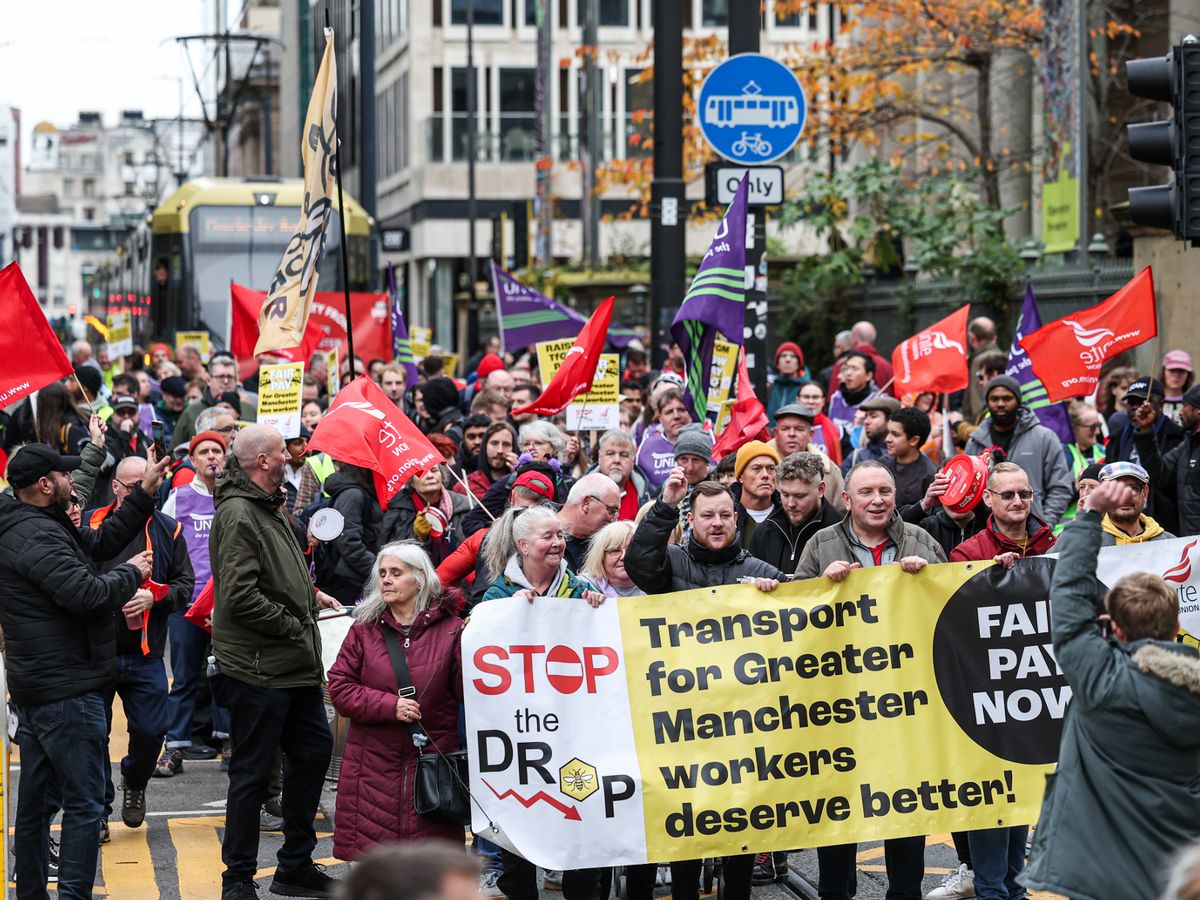 Striking TfGM staff stop traffic in Manchester city centre in ongoing pay row
