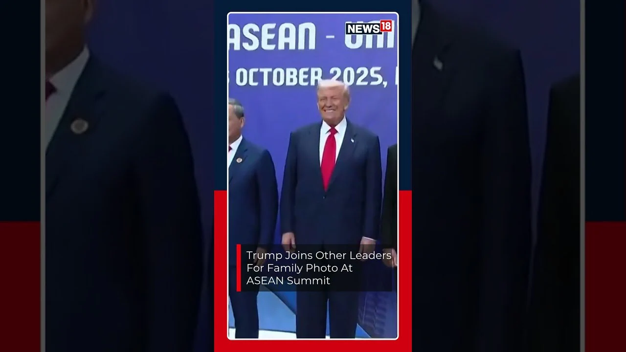 US President Donald Trump poses alongside other global leaders for a group photo at the ASEAN Summit
