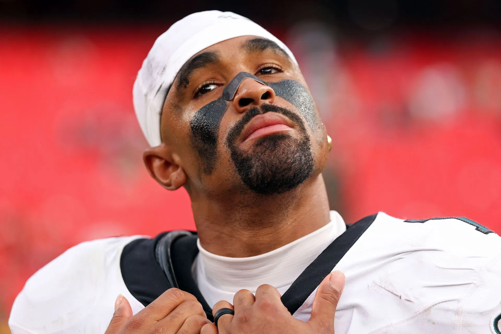 Bro looking like a monk Is that Bad Bunny?: NFL fans react to Jalen Hurts' full red gameday fit for Eagles vs Giants rematch