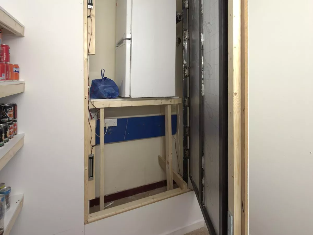 Illegal products found behind false wall during vape shop raids in Conwy