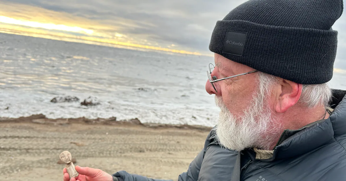 In the aftermath of Typhoon Halong, faces reveal themselves on a beach in Southwest Alaska