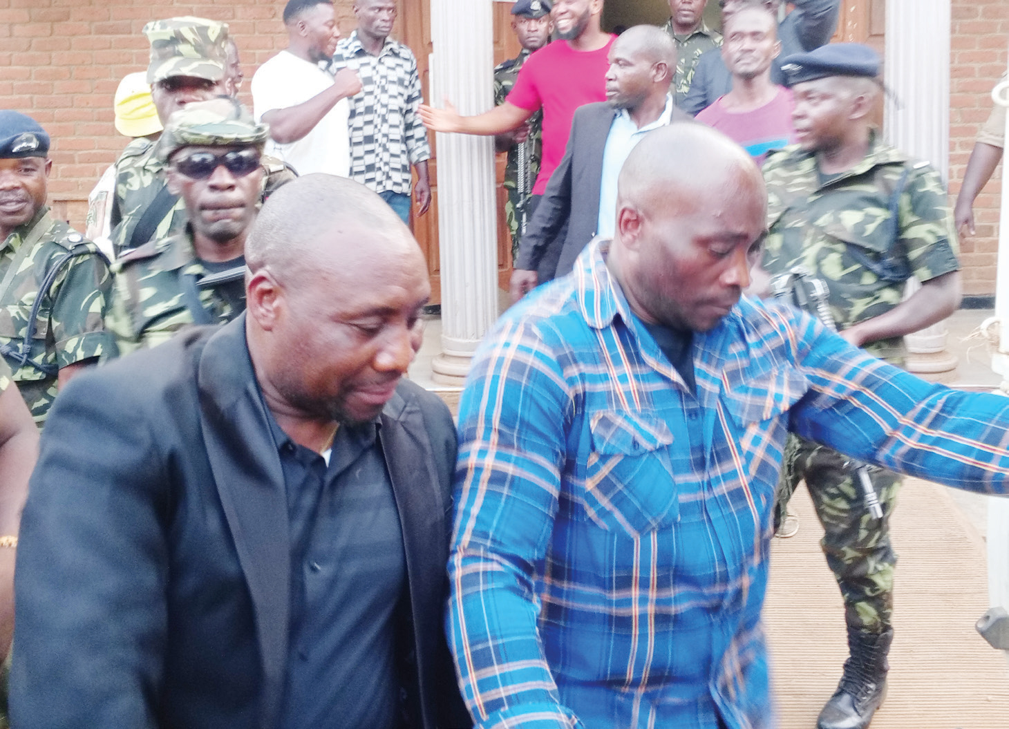 9 plead not guilty in violence case