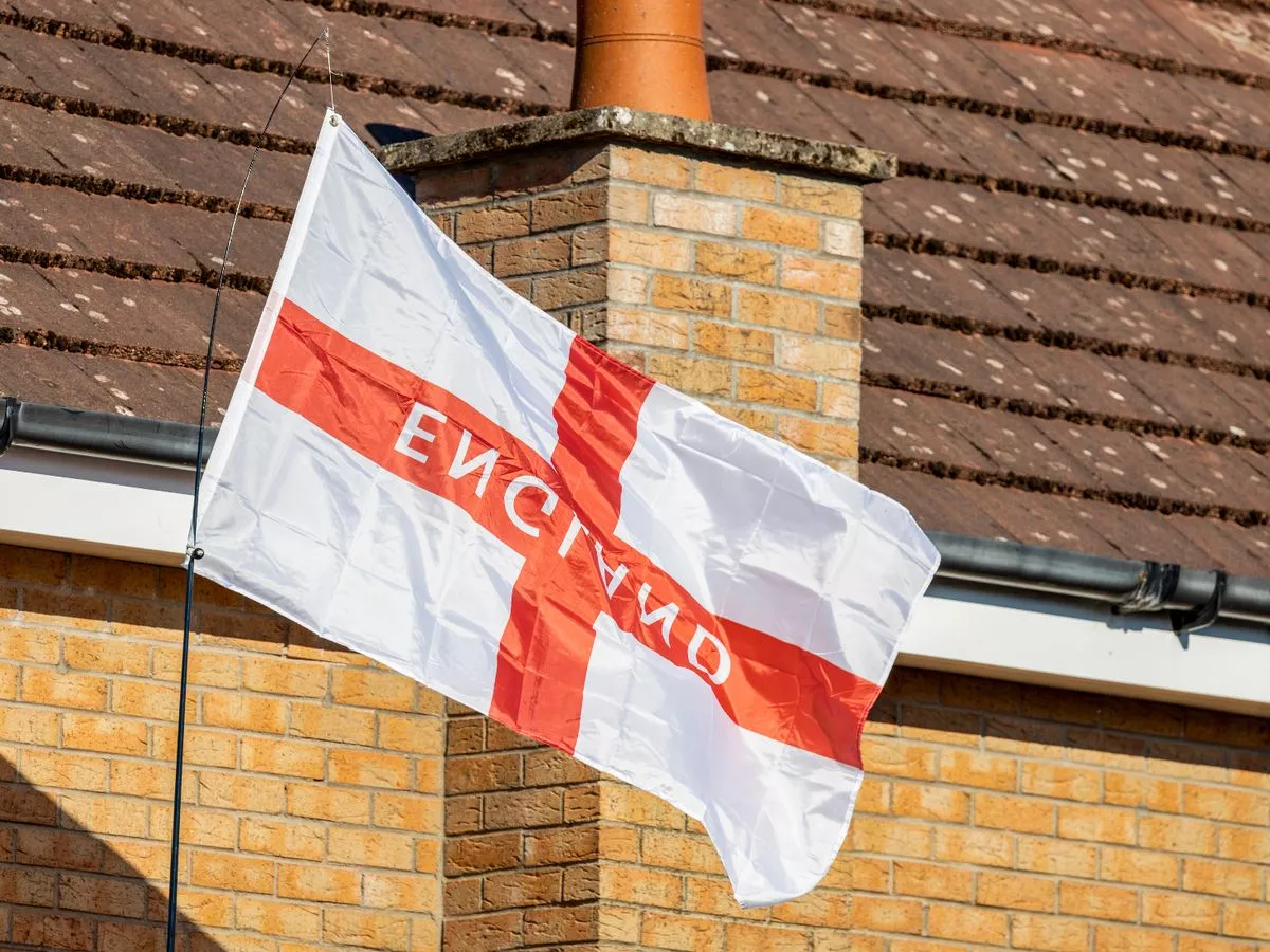 Pensioner 'battered by gang of thugs' while taking down England flags