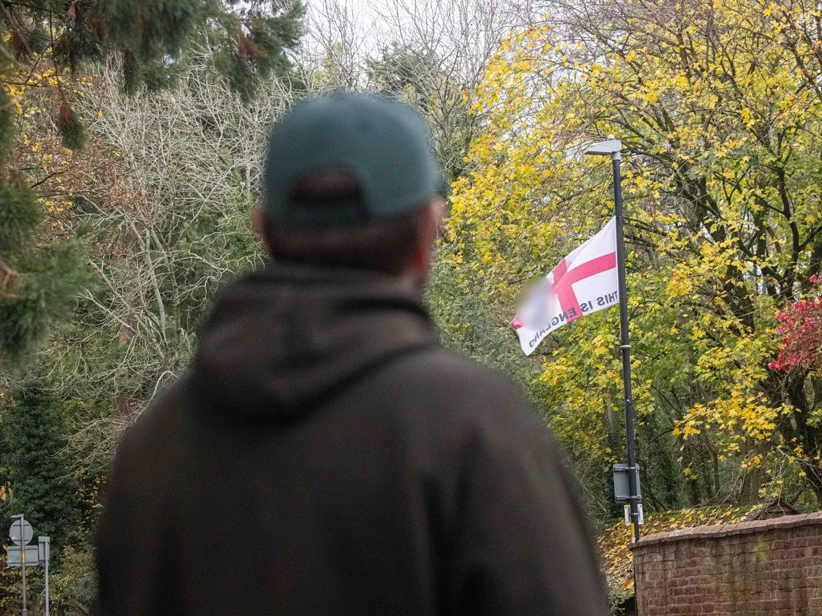 Birmingham flag wars erupt in quiet village as defiant dad faces death threats
