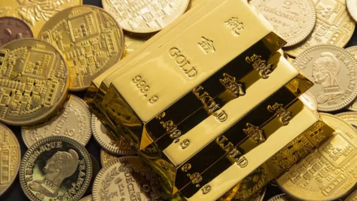 Gold Steadies On Stronger Dollar As Investors Trim Rate-Cut Bets