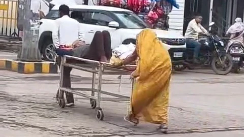 Viral video shows relatives pushing patient on stretcher through city road