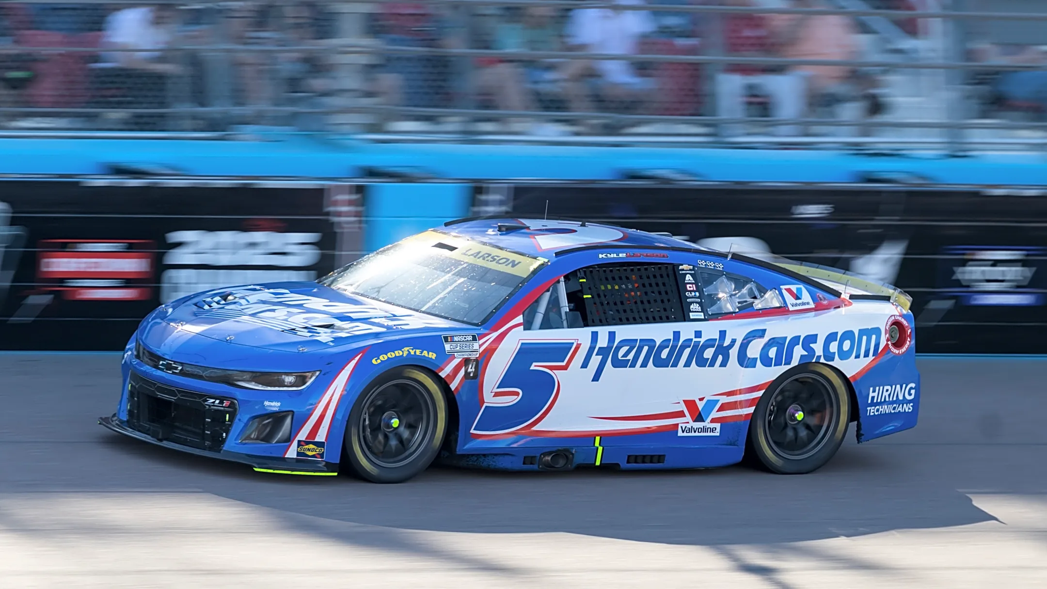 Kyle Larson edges Denny Hamlin for NASCAR title in OT; Ryan Blaney wins season finale