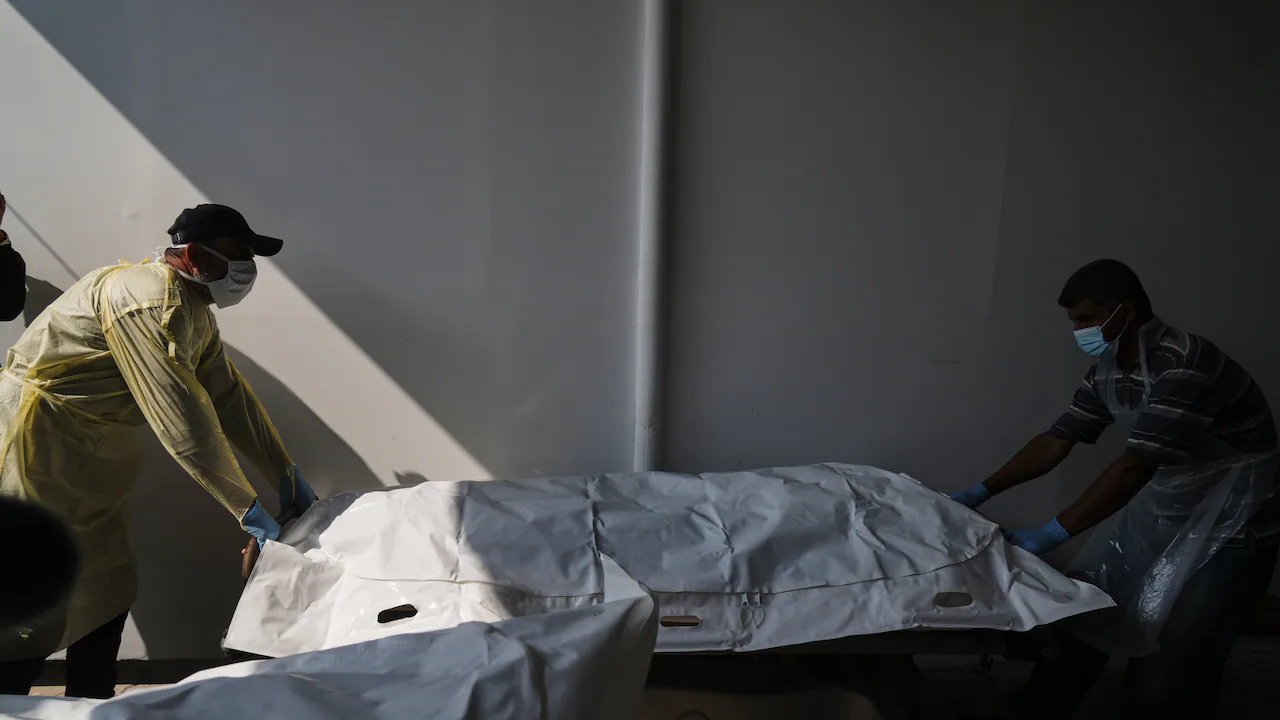 Israeli fire kills 3 people in Gaza, medics say, as hospital receives more Palestinian bodies