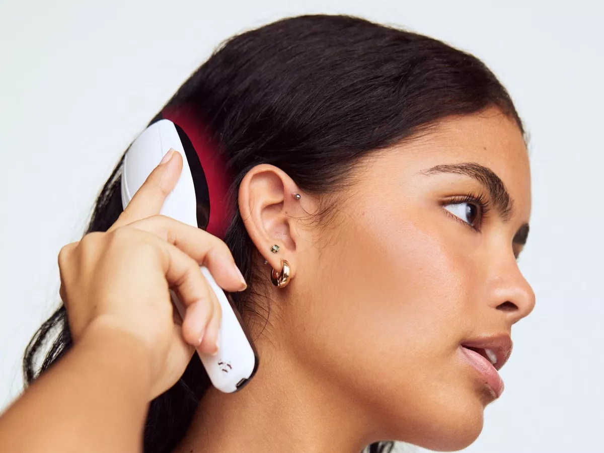 Woman with thinning hair swears by LED hair growth brush that stops loss