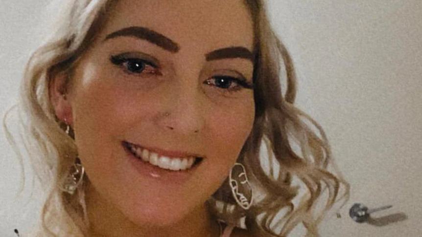 Lachlan Young stares blankly during minute's silence for Hannah McGuire