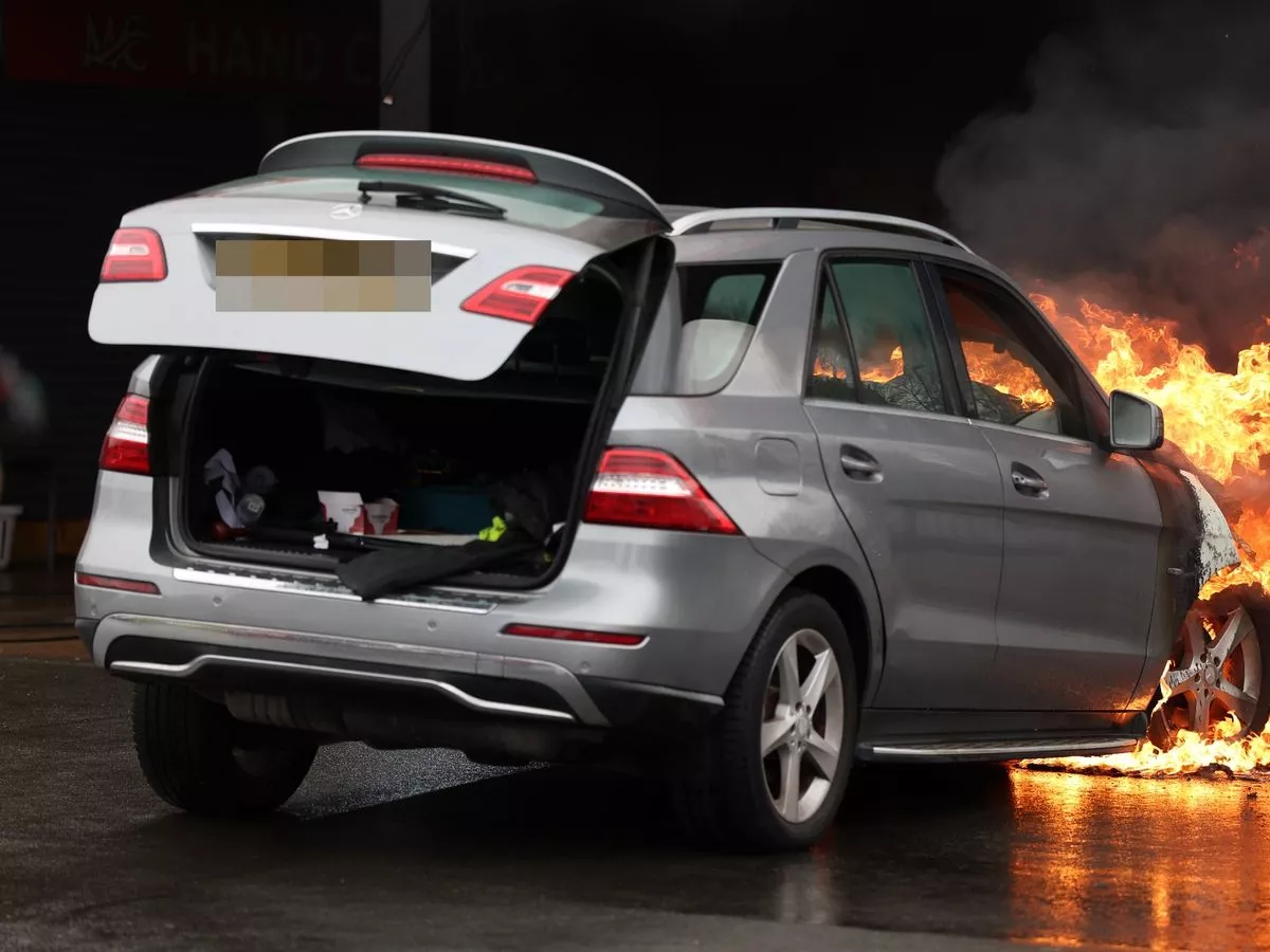 Road blocked after Mercedes bursts into flames as huge fire breaks out at car wash