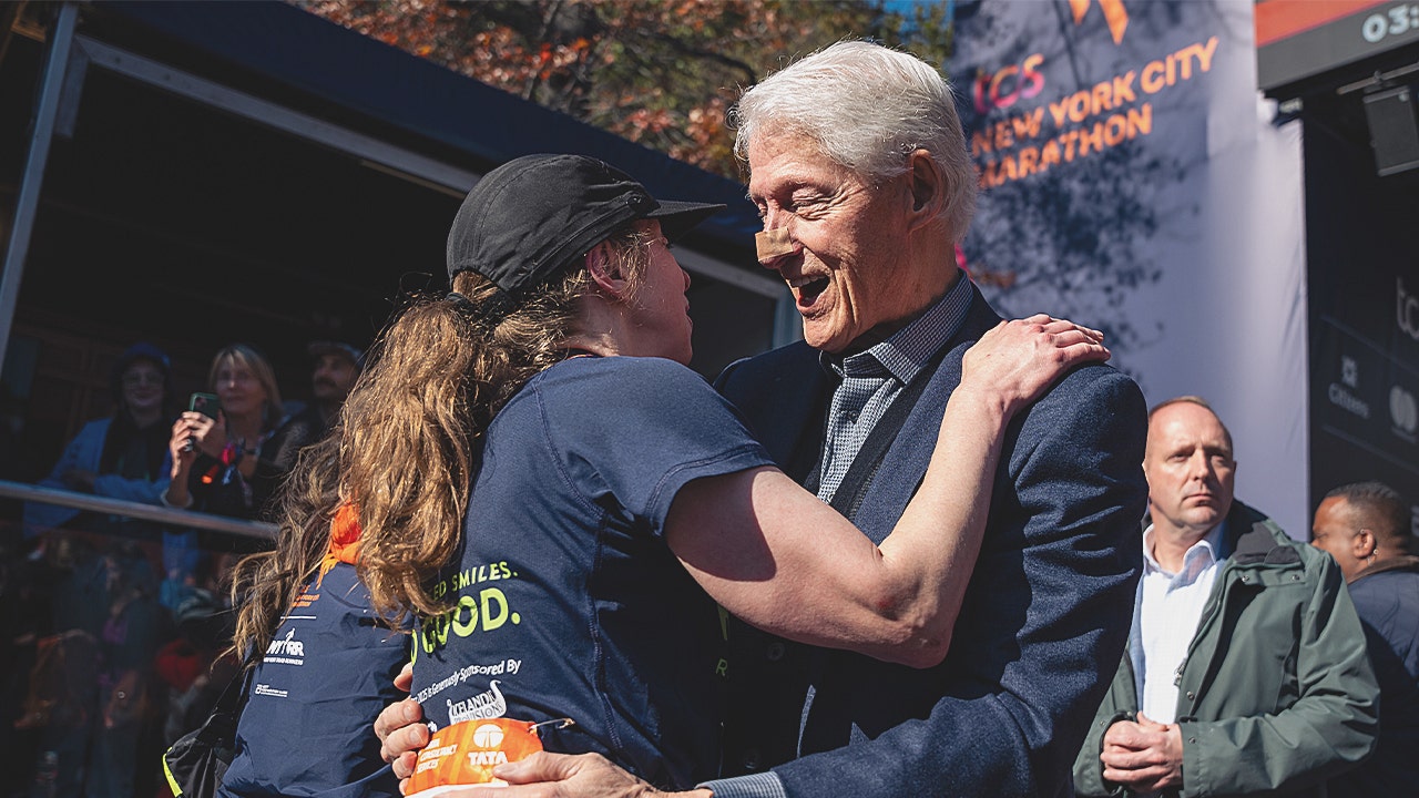 Bill Clinton spotted at NYC Marathon with bandaged nose while cheering on daughter Chelsea